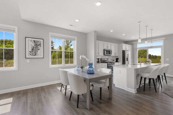 Contemporary dining area with elegant furnishings at Bentley Village Apartments, perfect for entertaining guests