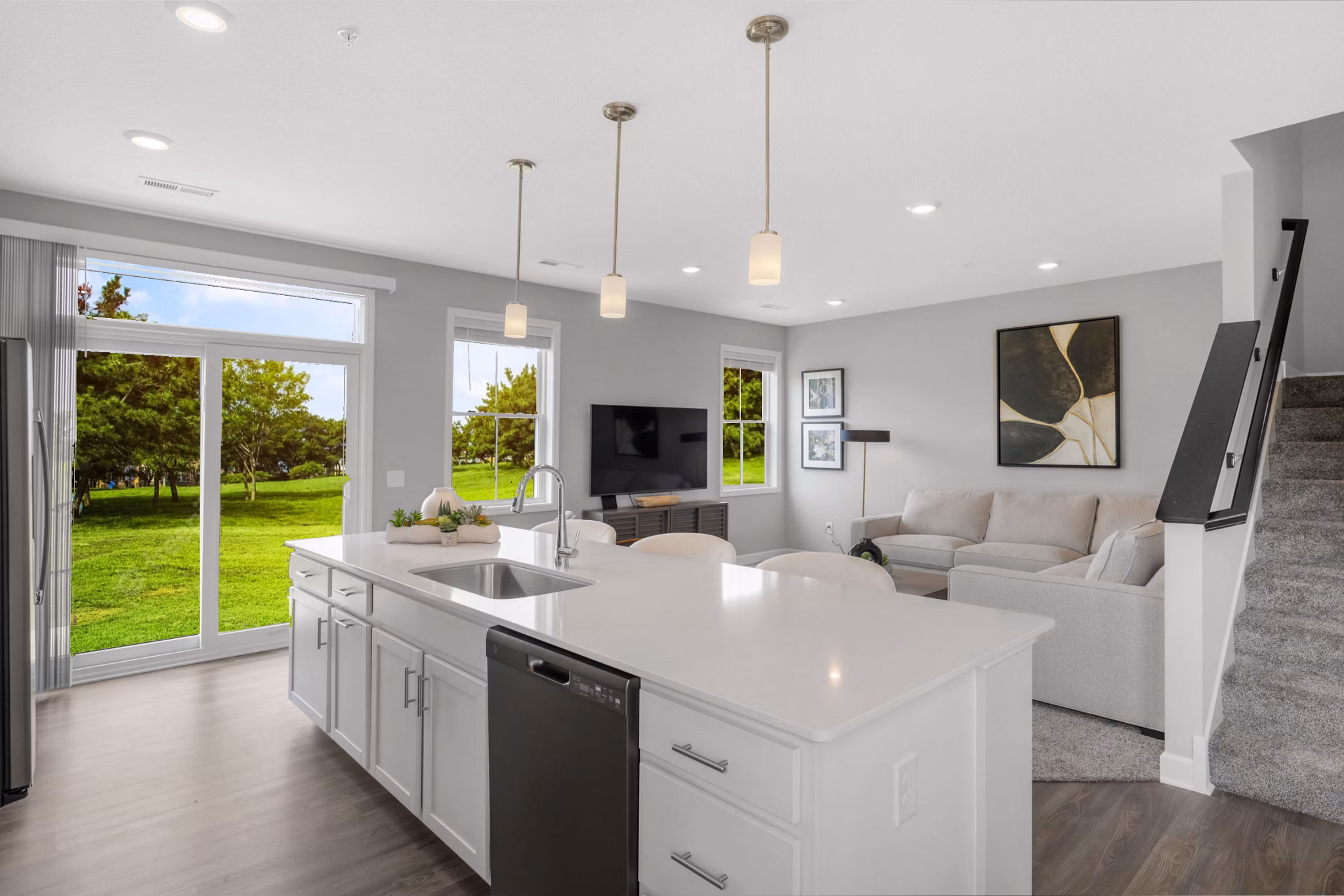 Spacious kitchen with granite countertops and modern appliances at Bentley Village Apartments