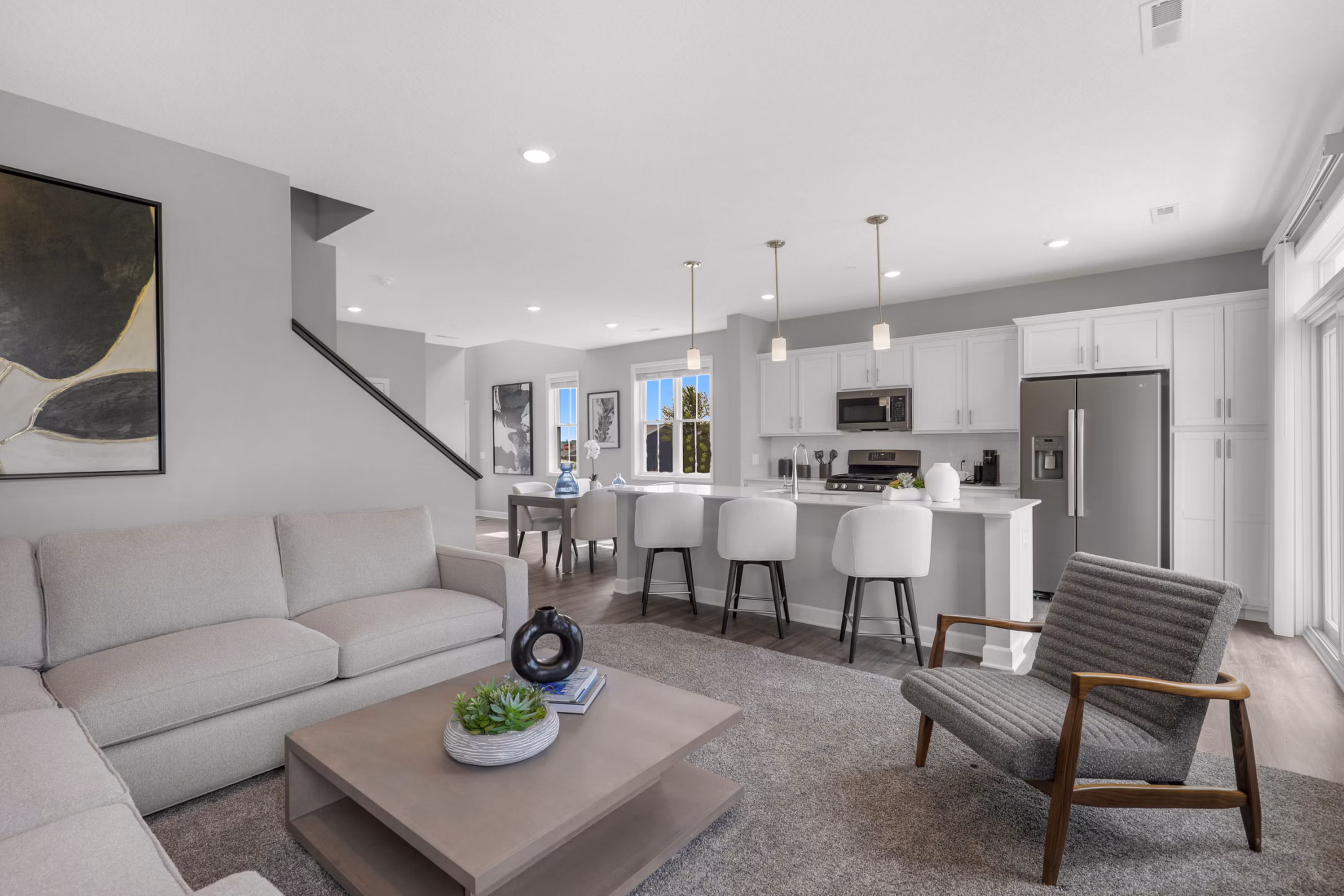 Spacious living room with modern furnishings at Bentley Village Apartments
