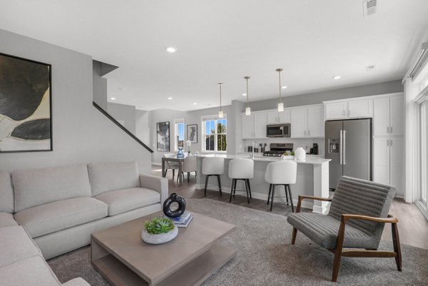 Spacious living room with modern furnishings at Bentley Village Apartments