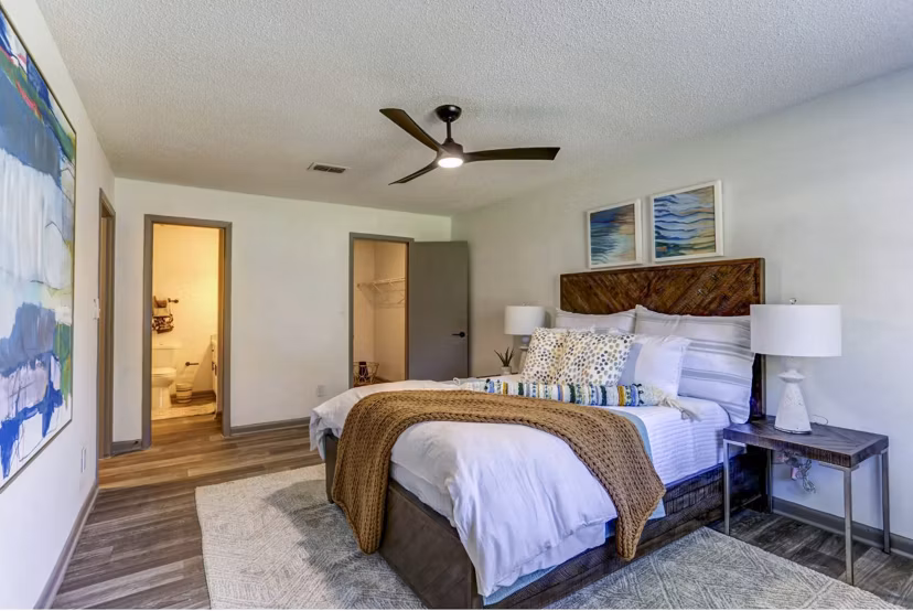 Bedroom featuring stylish modern furnishings at The Oakley Apartments