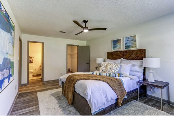 Bedroom featuring stylish modern furnishings at The Oakley Apartments