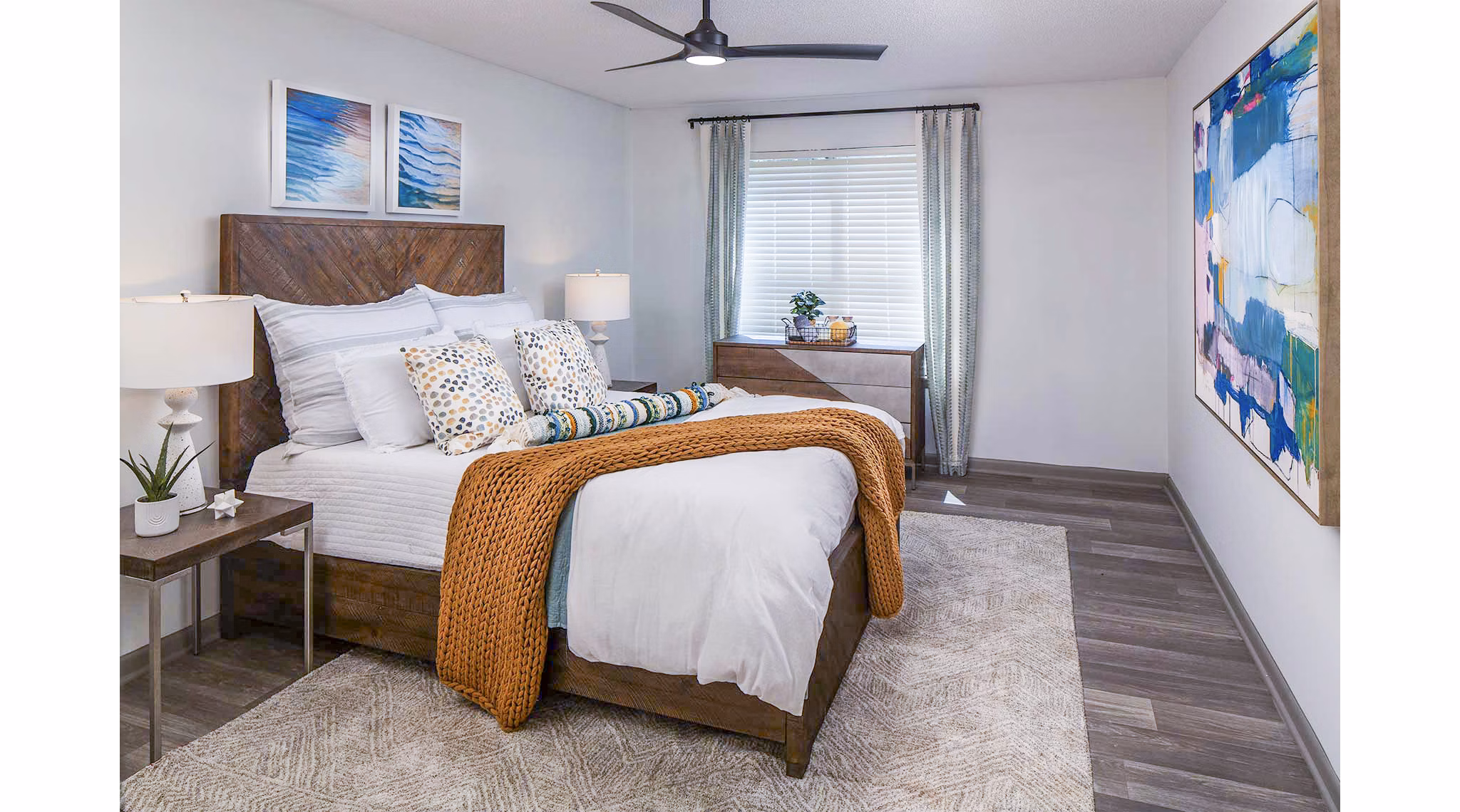 Cozy bedroom featuring modern furnishings at The Oakley Apartments, luxury living by Greystar