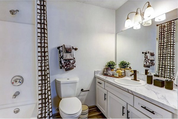 Bathroom with modern fixtures and sleek design at The Oakley Apartments