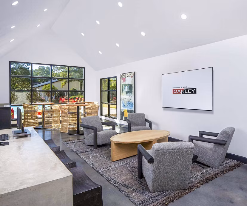 Clubhouse at The Oakley Apartments featuring modern design and ample seating areas Ideal for events and social gatherings in a luxurious setting