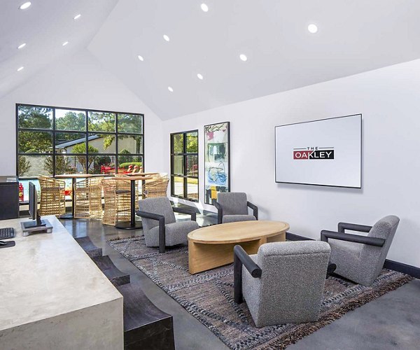 Clubhouse at The Oakley Apartments featuring modern design and ample seating areas Ideal for events and social gatherings in a luxurious setting