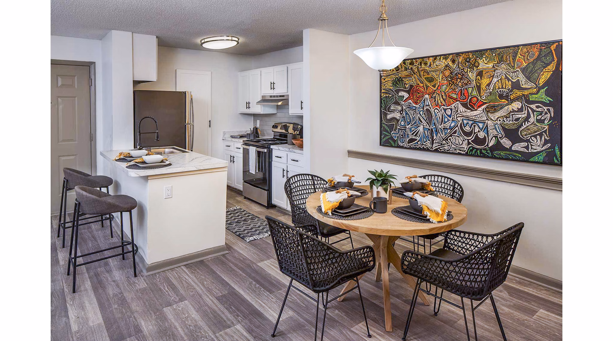 Dining room with modern furnishings at The Oakley Apartments, featuring elegant seating and contemporary design for a luxurious living experience