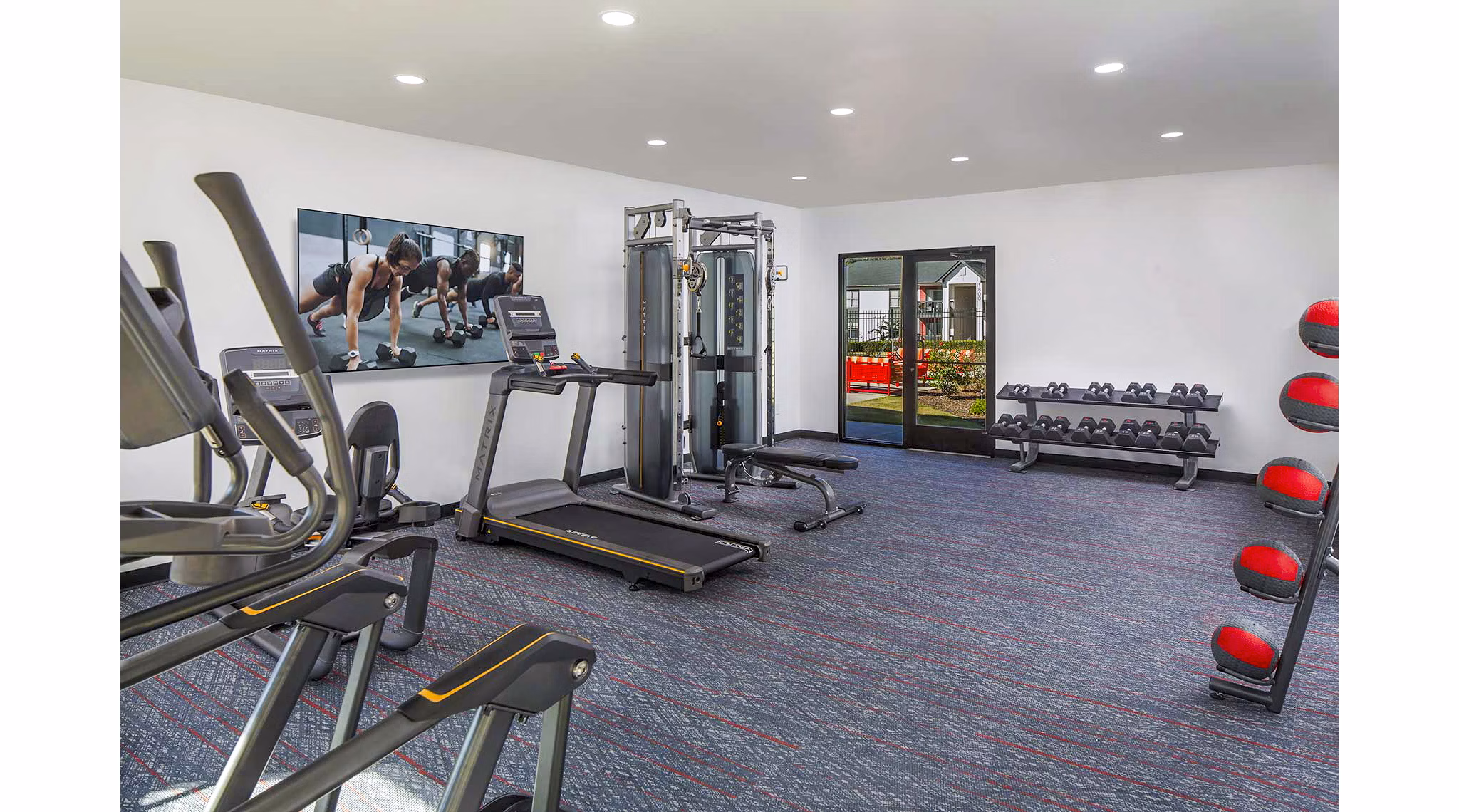 Fitness center featuring modern equipment at The Oakley Apartments