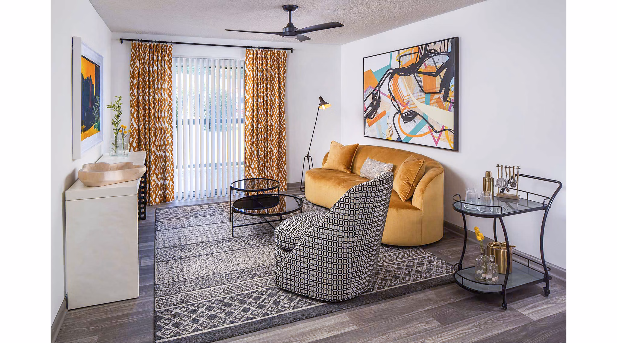 Spacious living room with modern decor in The Oakley Apartments, featuring comfortable seating and natural light