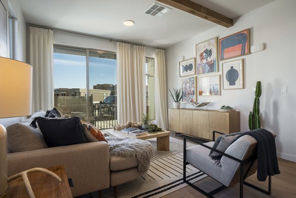 Modern living room with stylish furnishings at Encanto at Mesa Del Sol Apartments, offering luxury and comfort in every detail