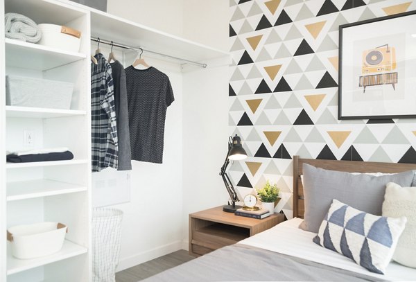 Cozy bedroom with modern decor at The Parsonage Apartments