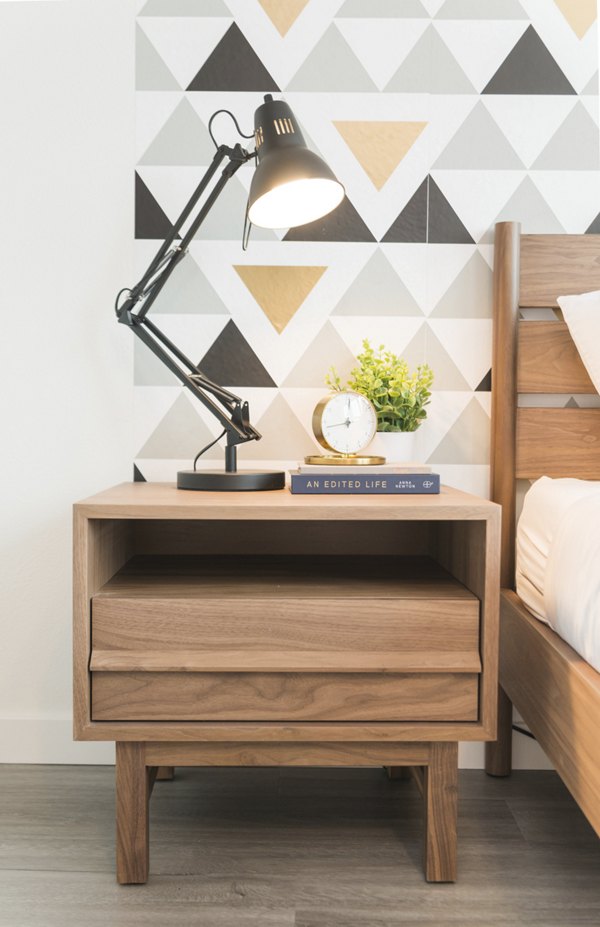 Bedroom featuring elegant decor and large windows at The Parsonage Apartments