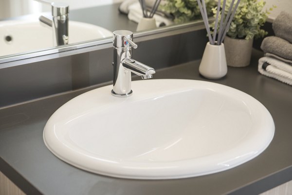 Contemporary bathroom with sleek fixtures at The Parsonage Apartments, offering luxury and modern design for residents