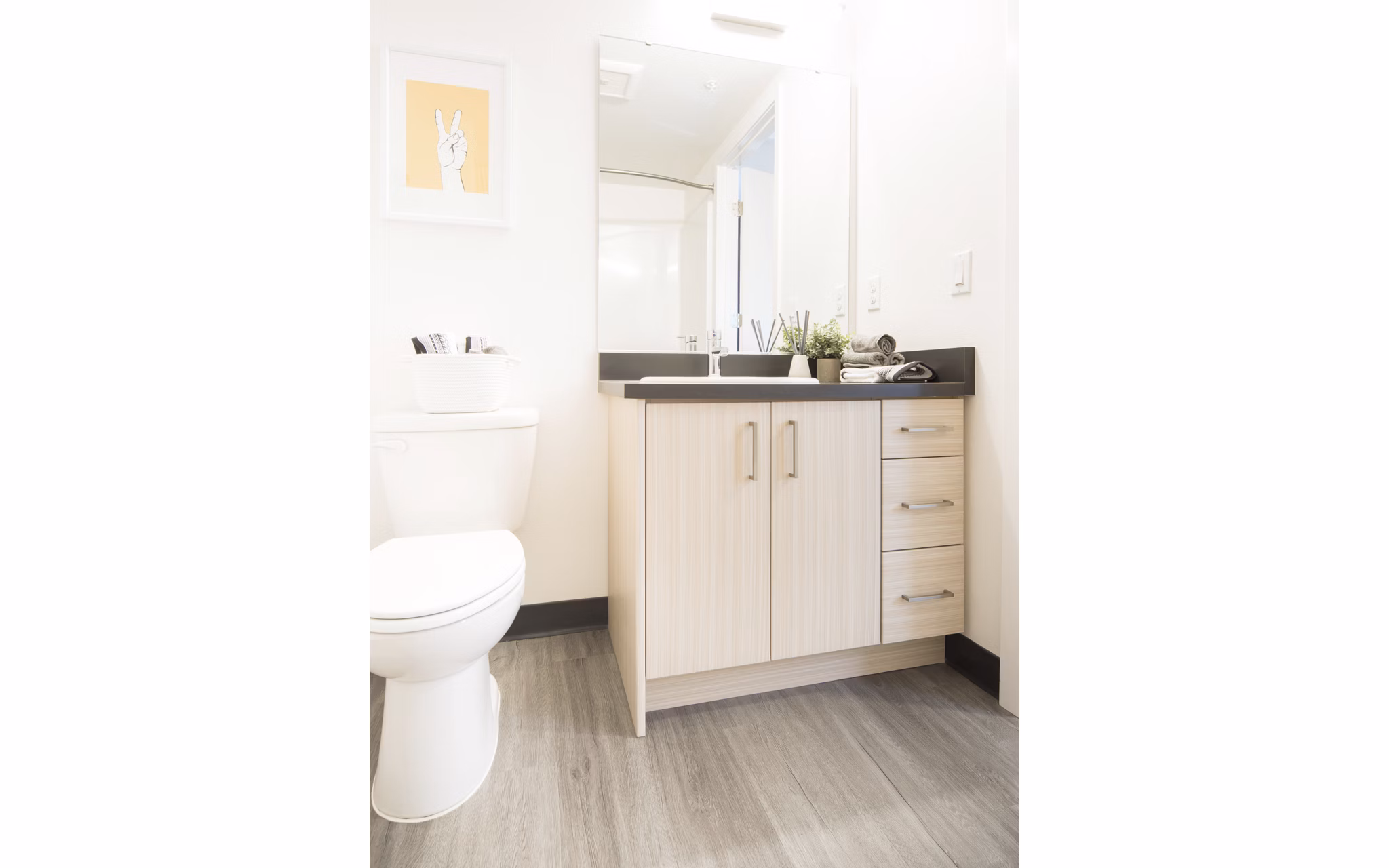 Luxurious bathroom with marble countertops and soaking tub at The Parsonage Apartments