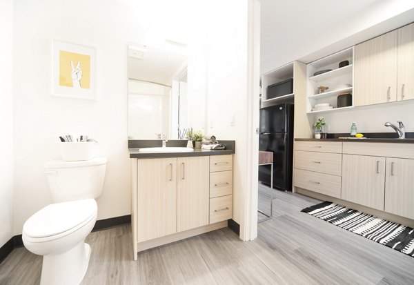 Luxurious bathroom featuring marble countertops and modern fixtures at The Parsonage Apartments