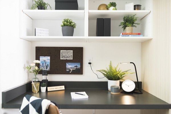 Modern home office with sleek desk and ergonomic chair at The Parsonage Apartments