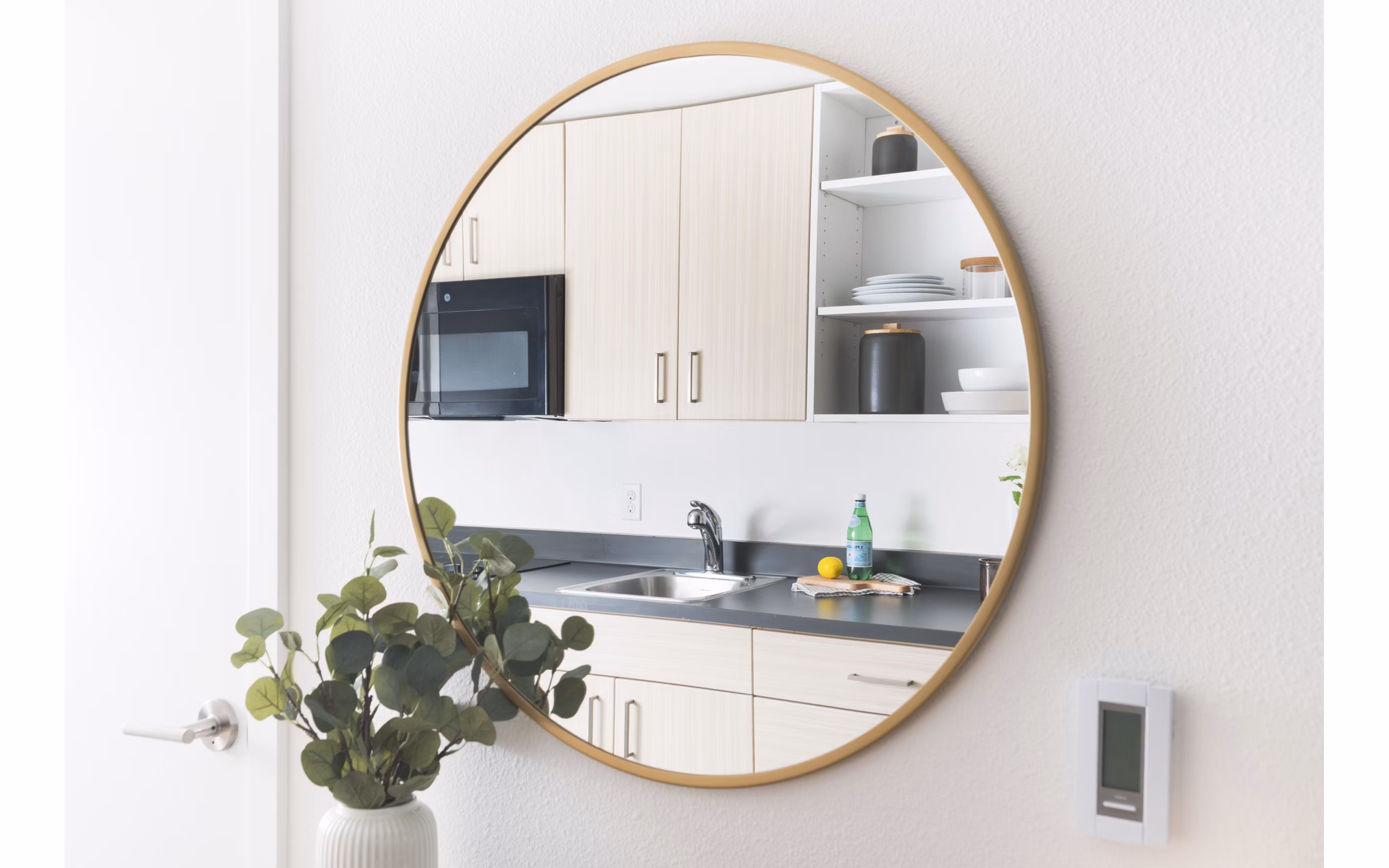 Elegant kitchen with granite countertops and modern appliances in The Parsonage Apartments