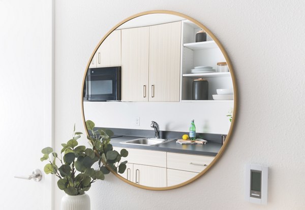 Elegant kitchen with granite countertops and modern appliances in The Parsonage Apartments