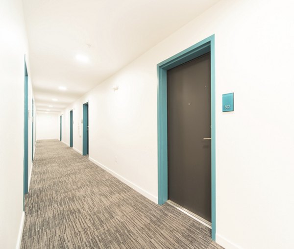 Contemporary hallway featuring modern design elements in The Parsonage Apartments