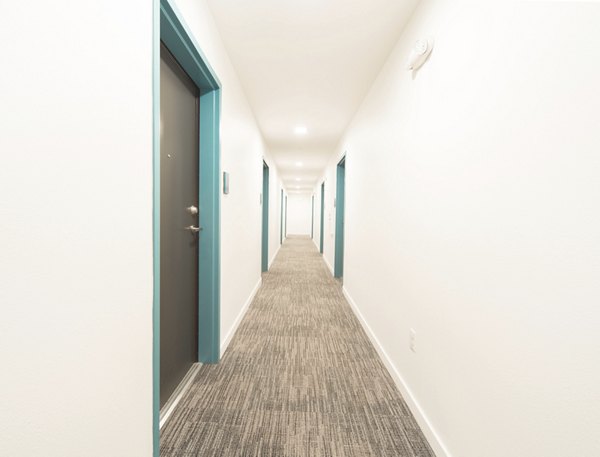Hallway featuring elegant lighting and modern design in The Parsonage Apartments
