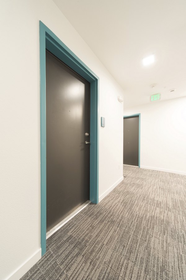Hallway featuring contemporary design and elegant lighting at The Parsonage Apartments