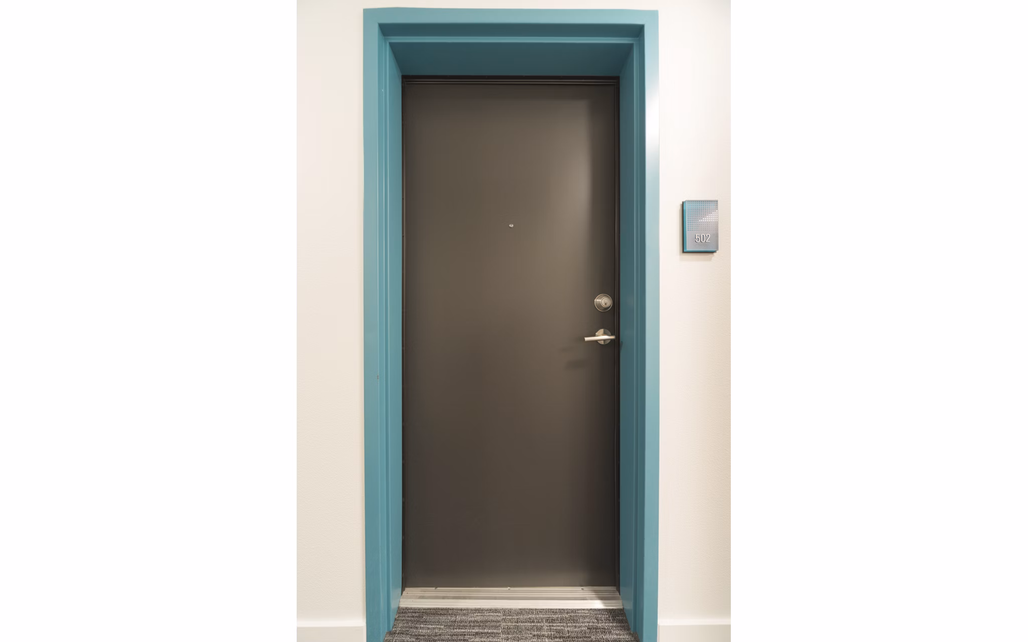 Hallway featuring modern art and sleek lighting in The Parsonage Apartments