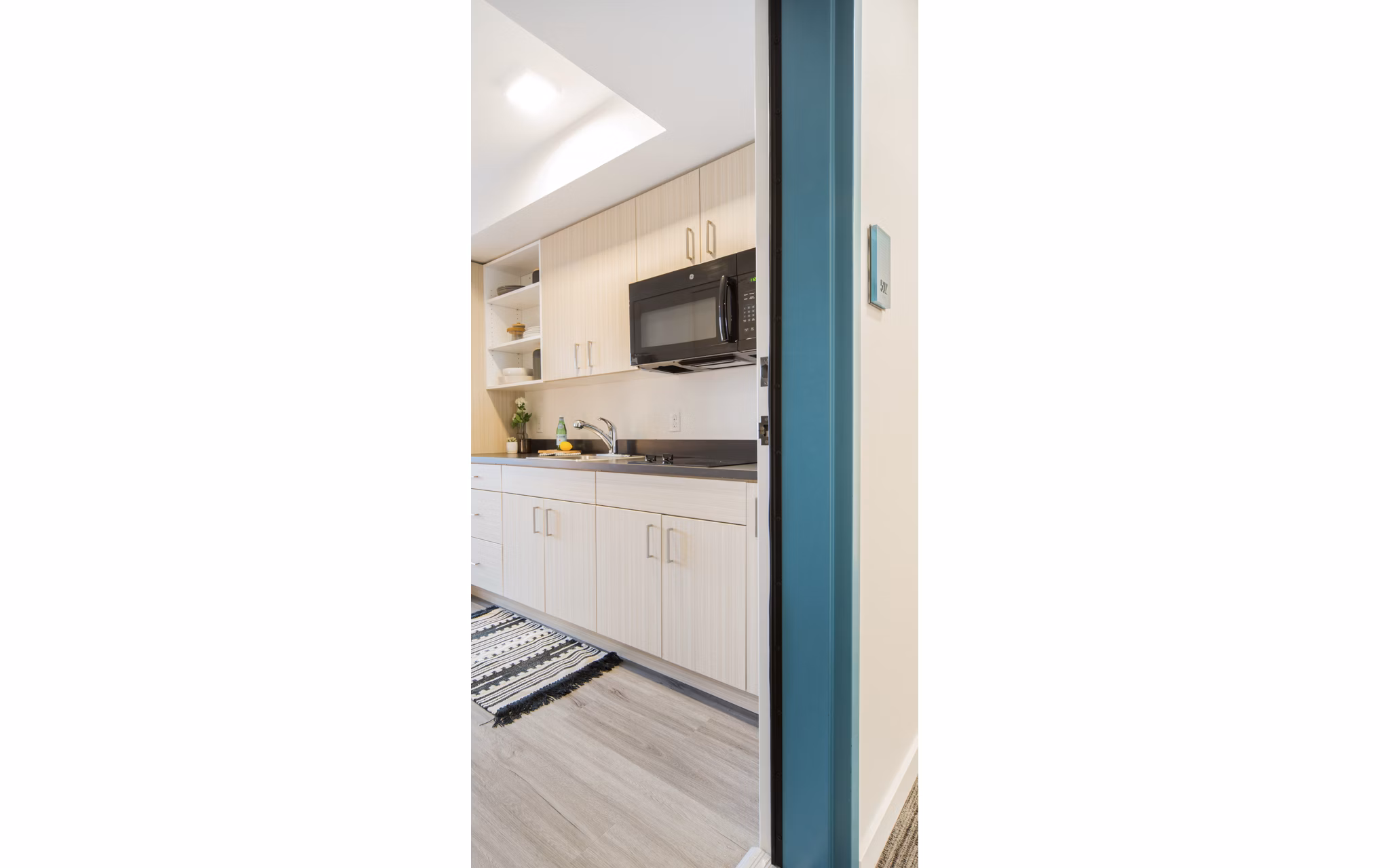 Contemporary hallway with chic decor at The Parsonage Apartments
