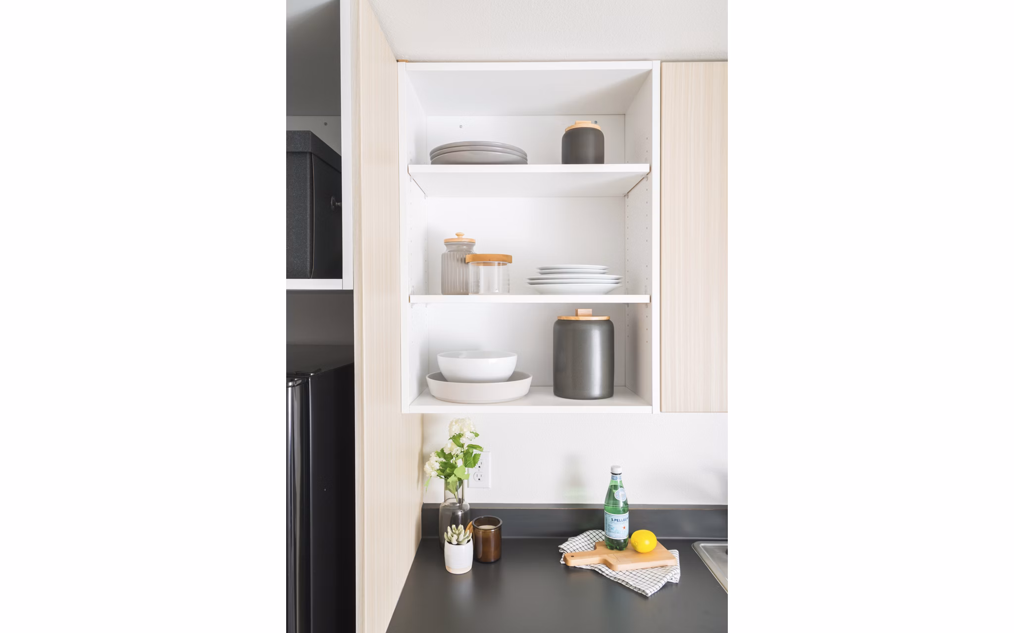 Modern kitchen with stainless steel appliances at The Parsonage Apartments