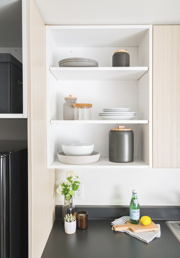 Modern kitchen with stainless steel appliances at The Parsonage Apartments