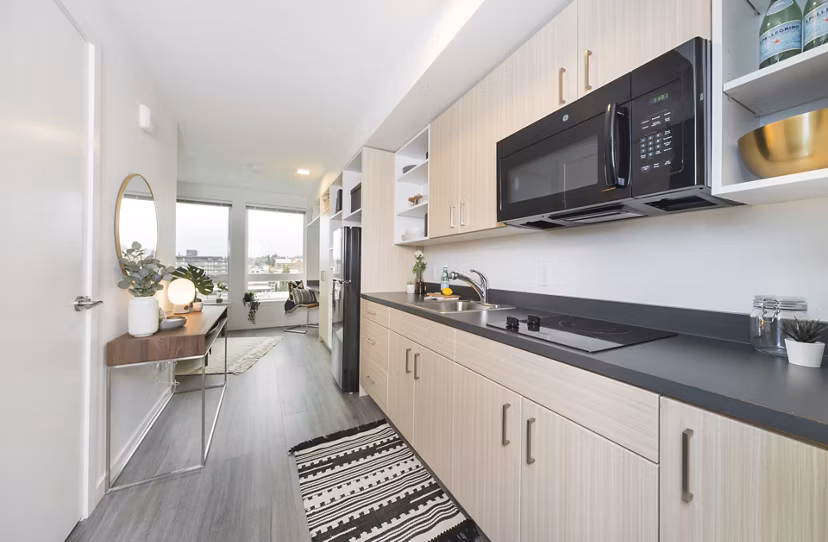The Parsonage Apartments: Modern kitchen with stainless steel appliances and sleek countertops