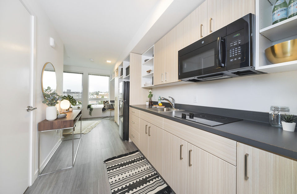 The Parsonage Apartments: Modern kitchen with stainless steel appliances and sleek countertops
