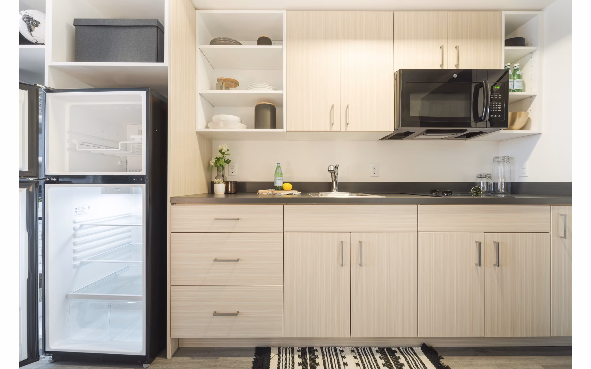 Modern kitchen with sleek countertops and stainless steel appliances at The Parsonage Apartments