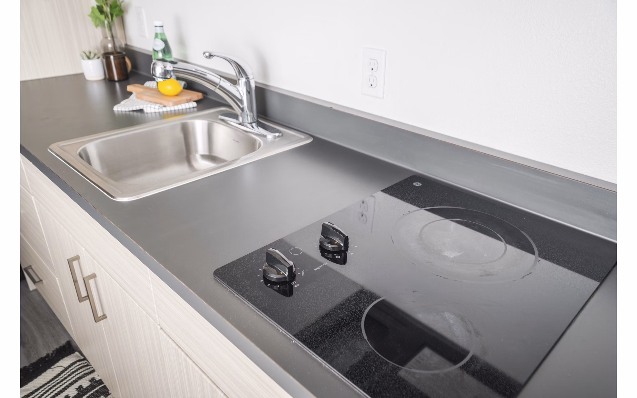 Modern kitchen with stainless steel appliances in The Parsonage Apartments, inviting luxury living in a premier community