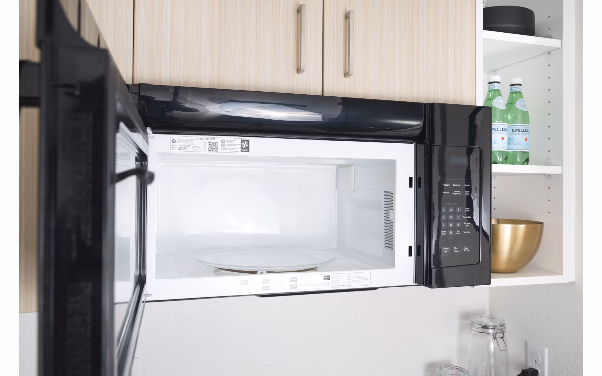 Modern kitchen with stainless steel appliances in The Parsonage Apartments