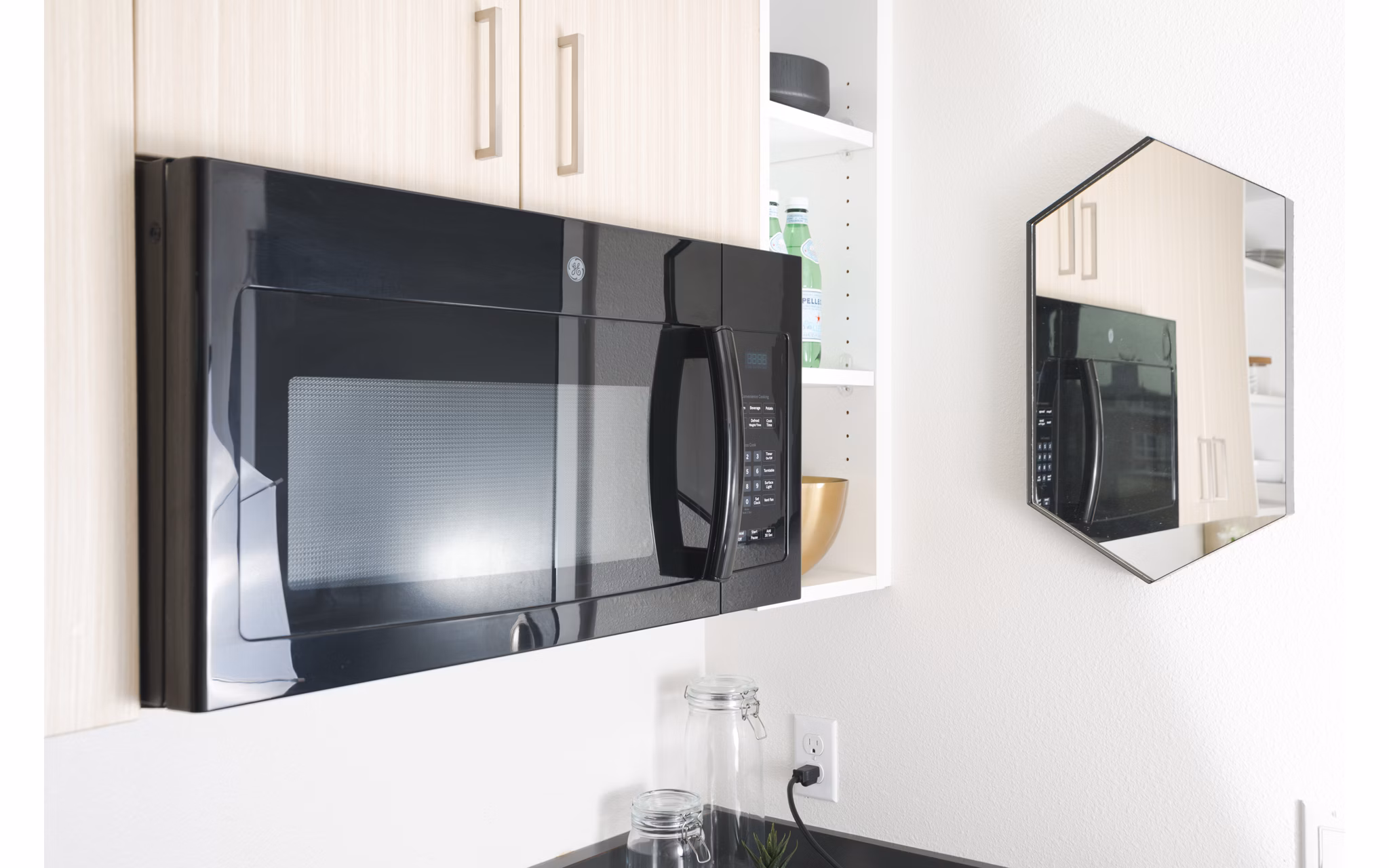 Modern kitchen with sleek stainless steel appliances in The Parsonage Apartments