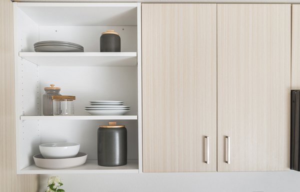 Modern kitchen with stainless steel appliances in The Parsonage Apartments, ideal for luxury living