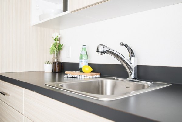 The Parsonage Apartments: Modern kitchen with stainless steel appliances and granite countertops