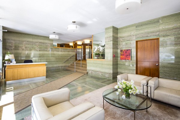 Stylish clubhouse lobby with modern seating and decor at 1000 Chestnut Apartments