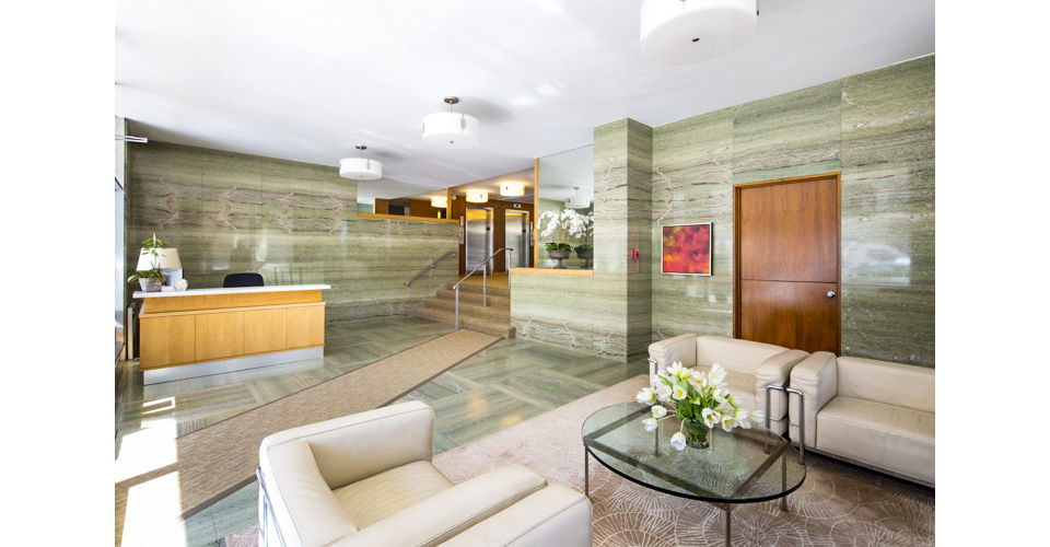 Stylish clubhouse lobby with modern seating and decor at 1000 Chestnut Apartments