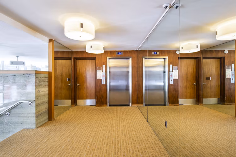 Clubhouse lobby with elevator access at 1000 Chestnut Apartments, Greystar luxury apartments in vibrant city setting