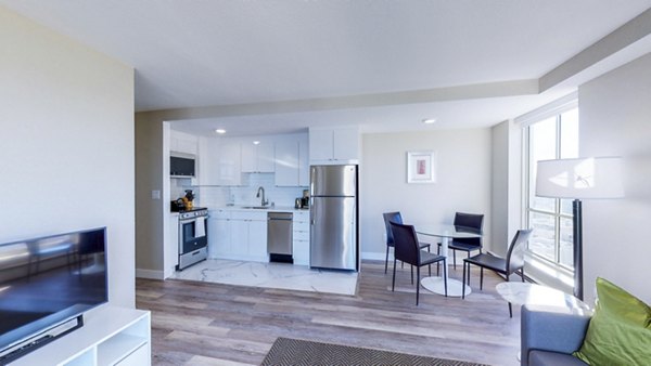 Elegant dining room with chic lighting fixtures at 1000 Chestnut Apartments in San Francisco