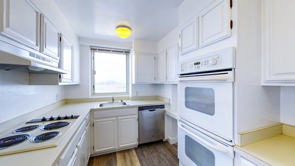 Kitchen with modern appliances and granite countertops at 1000 Chestnut Apartments, Greystar luxury apartments in San Francisco