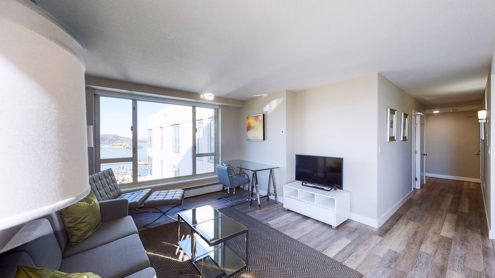 Cozy living room with modern furnishings at 1000 Chestnut Apartments, offering luxury living spaces in a prime location