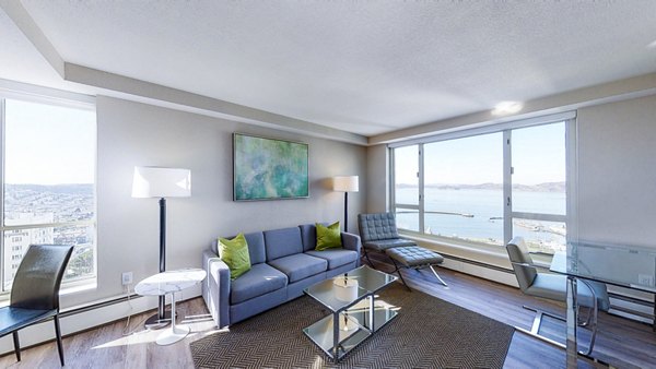 Elegant living room with modern furniture and bay views at 1000 Chestnut Apartments, luxurious living in San Francisco