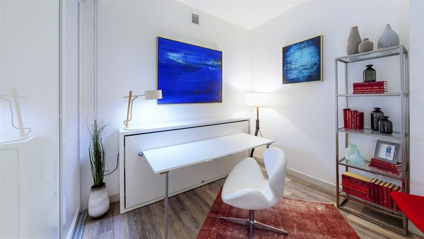 Comfortable bedroom with integrated home office at 1177 Market Apartments, San Francisco luxury living