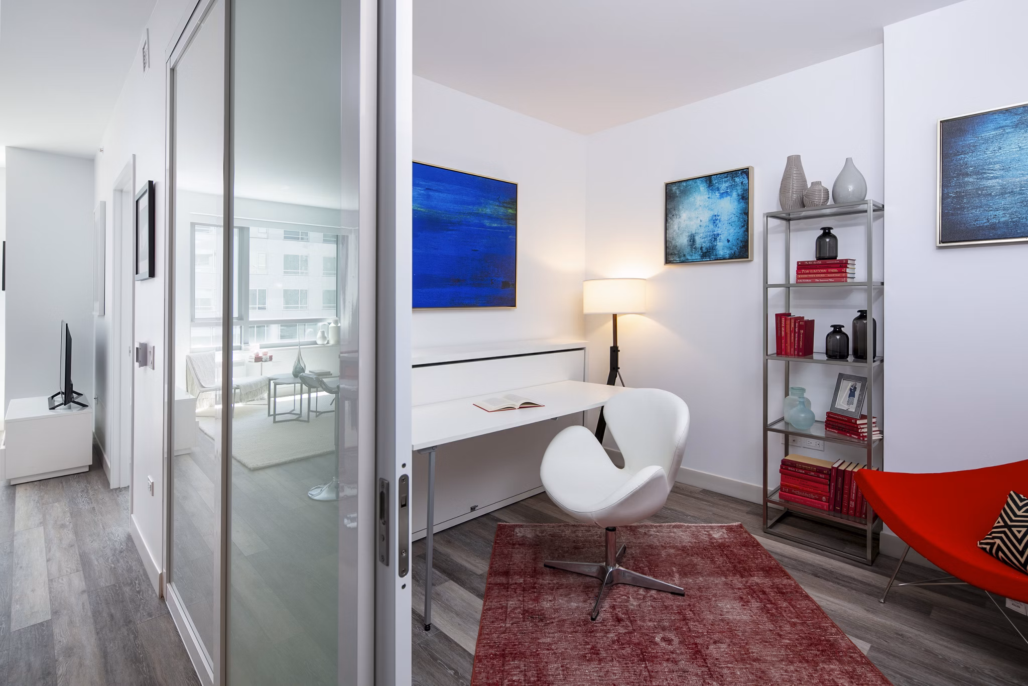 Bedroom and home office combination with modern furnishings at 1177 Market Apartments, offering versatile living in a luxury Greystar community