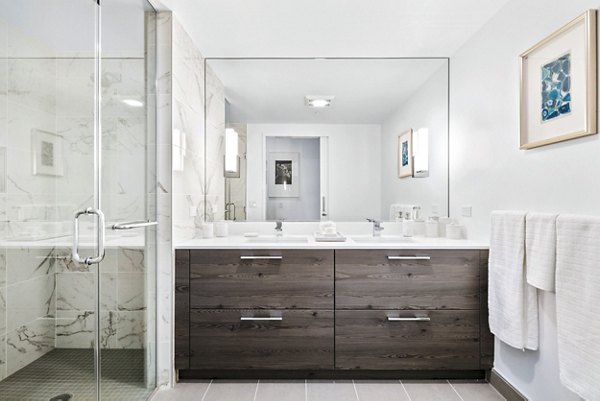 Bathroom with sleek fixtures and modern design at 1177 Market Apartments