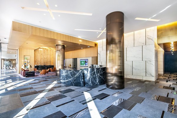 Clubhouse lobby with modern furnishings at 1177 Market Apartments, a Greystar luxury community