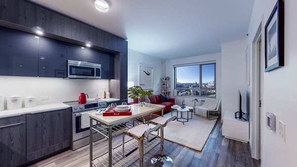 Open-concept kitchen and dining area with modern finishes at 1177 Market Apartments