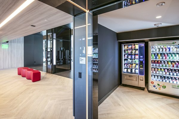 Modern fitness center with vending machines at 1177 Market Apartments